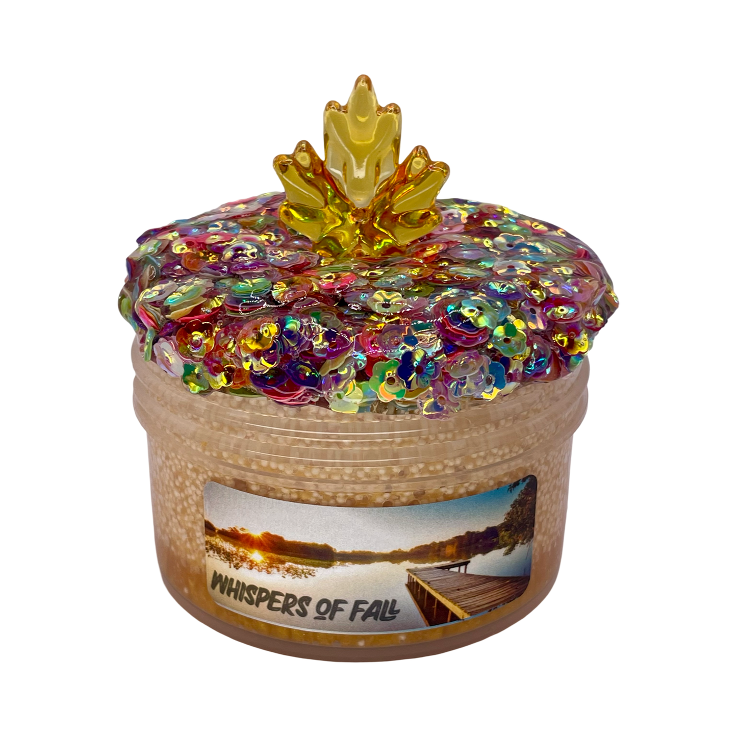 Decorative slime jar with colorful flower sequin topper and 'Whispers of Fall' label on a white background